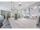 Bright kitchen featuring custom cabinetry, a center island with a marble countertop, and stainless steel appliances at 1391 Marinella Dr, Palm Harbor, FL 34683