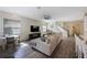 Spacious living room with shiplap wall, wood floors, and a comfortable seating area at 1391 Marinella Dr, Palm Harbor, FL 34683
