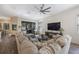 Bright living room featuring a large sectional sofa, ceiling fan, and view of the patio at 1391 Marinella Dr, Palm Harbor, FL 34683