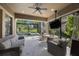 Screened-in patio with a view of the pool and golf course at 1391 Marinella Dr, Palm Harbor, FL 34683