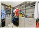 Organized walk-in closet with custom shelving and drawers, maximizing storage potential at 1391 Marinella Dr, Palm Harbor, FL 34683