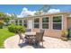Outdoor patio with seating, perfect for entertaining and enjoying the lush backyard at 1510 Palmer Ct, Palm Harbor, FL 34685