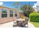 Backyard featuring a lovely patio with a table and chairs, perfect for outdoor entertaining at 1510 Palmer Ct, Palm Harbor, FL 34685