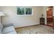Bright room featuring a comfortable couch, large window with green views, and a decorative rug at 1510 Palmer Ct, Palm Harbor, FL 34685