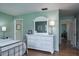 Bedroom with dresser, metal bed frame, and natural light at 1510 Palmer Ct, Palm Harbor, FL 34685