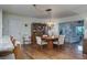 Dining room adjacent to a kitchen with breakfast bar and updated appliances at 1510 Palmer Ct, Palm Harbor, FL 34685