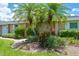 Charming villa with lush landscaping and palm trees at 1510 Palmer Ct, Palm Harbor, FL 34685