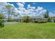 Charming villa featuring an attached garage and lush landscaping at 1510 Palmer Ct, Palm Harbor, FL 34685
