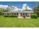 Beautifully landscaped backyard with a patio and seating area, perfect for enjoying outdoor living at 1510 Palmer Ct, Palm Harbor, FL 34685