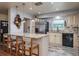 Bright eat-in kitchen with granite counters, stainless fridge, and ample cabinet space at 1510 Palmer Ct, Palm Harbor, FL 34685