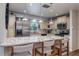 Spacious kitchen with stainless appliances, granite counters, and breakfast bar at 1510 Palmer Ct, Palm Harbor, FL 34685