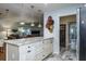 Modern kitchen island with granite countertop and pendant lighting at 1510 Palmer Ct, Palm Harbor, FL 34685