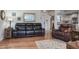 Comfortable living room boasts a leather sofa set, hardwood floors, and stylish decor at 1510 Palmer Ct, Palm Harbor, FL 34685