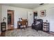 Bright room featuring neutral decor, a desk, chair, decorative area rug, and exterior views at 1510 Palmer Ct, Palm Harbor, FL 34685