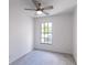 Cozy bedroom with neutral carpet and natural light coming through the window at 16175 Rambling Vine E Dr, Tampa, FL 33624