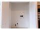 Empty utility closet with bi fold doors and bare wall at 16175 Rambling Vine E Dr, Tampa, FL 33624