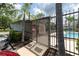 Gated community pool area with lounge chairs and clear blue water invites you to relax and enjoy the outdoors at 16175 Rambling Vine E Dr, Tampa, FL 33624