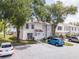 Well-maintained townhomes with parking and mature trees offer comfortable and convenient living at 16175 Rambling Vine E Dr, Tampa, FL 33624
