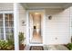 Open entryway showcases a bright interior with tile flooring, fireplace, and an abundance of natural light at 16175 Rambling Vine E Dr, Tampa, FL 33624
