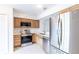 Bright kitchen with stainless steel appliances, quartz countertops, and light wood cabinets at 16175 Rambling Vine E Dr, Tampa, FL 33624