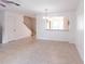 Spacious living room with pass through to the kitchen and stairs to the second floor at 16175 Rambling Vine E Dr, Tampa, FL 33624