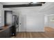 Modern kitchen with stainless steel appliances, black cabinets, wood countertops and hardwood floors at 1707 Windsor Way, Tampa, FL 33619