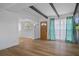 Bright living room with beamed ceilings, hardwood floors, stylish furnishings and natural light at 1707 Windsor Way, Tampa, FL 33619