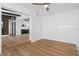Open-concept space with hardwood floors, beamed ceilings and views to the kitchen at 1707 Windsor Way, Tampa, FL 33619