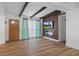 Bright living room with beamed ceilings, hardwood floors, a modern fireplace and lots of natural light at 1707 Windsor Way, Tampa, FL 33619