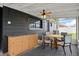 Relaxing screened porch with seating, fan and view of the backyard at 1707 Windsor Way, Tampa, FL 33619