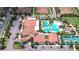 Community clubhouse featuring a swimming pool and other outdoor amenities at 17140 Holly Well Ave, Wimauma, FL 33598