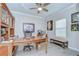 Well-appointed home office with custom built-ins, ample storage, and natural light at 17140 Holly Well Ave, Wimauma, FL 33598
