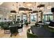A stylish lounge area with comfortable seating creates a welcoming atmosphere at 17140 Holly Well Ave, Wimauma, FL 33598