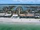Stunning aerial view of beachfront property with serene waterfront vistas and gorgeous community at 202 Howard Dr, Belleair Beach, FL 33786
