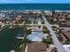 An aerial shot features the property within its coastal community near the Gulf at 202 Howard Dr, Belleair Beach, FL 33786
