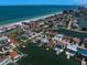 Picturesque waterfront homes with private docks along a canal, providing easy access to the Gulf of Mexico at 202 Howard Dr, Belleair Beach, FL 33786