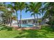 Gorgeous backyard with a refreshing pool and lots of shade trees at 202 Howard Dr, Belleair Beach, FL 33786