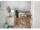 Inviting living room showcasing wood-look tile floors and stylish furniture with coastal accents and decor at 202 Howard Dr, Belleair Beach, FL 33786