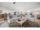 Bright living room features hardwood floors, comfortable couches, and an open-concept design at 202 Howard Dr, Belleair Beach, FL 33786