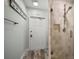 Shower with glass doors and a tiled surround, complemented by a light blue wall at 202 Howard Dr, Belleair Beach, FL 33786