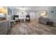 Sitting room featuring two upholstered chairs, tile floors and natural light from the shuttered windows at 202 Howard Dr, Belleair Beach, FL 33786