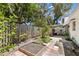 Landscaped backyard with a patio and a mix of plants, and a small garden bed at 204 Mindy Dr, Largo, FL 33771