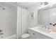 Clean, bright bathroom featuring a shower-tub combo and a classic white vanity at 204 Mindy Dr, Largo, FL 33771
