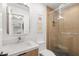Modern bathroom with glass-enclosed shower and stylish wood-look wall at 204 Mindy Dr, Largo, FL 33771
