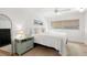 Bright bedroom with white walls, light wood floors, and a stylish accent rug at 204 Mindy Dr, Largo, FL 33771