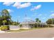Community clubhouse with a swimming pool and landscaped grounds at 204 Mindy Dr, Largo, FL 33771