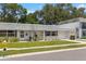 Lovely single story home featuring green grass, a private garage and a sidewalk at 204 Mindy Dr, Largo, FL 33771