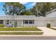 Inviting single story home with a well-manicured lawn, a private garage, and pleasant landscaping at 204 Mindy Dr, Largo, FL 33771