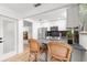 Contemporary kitchen featuring stainless steel appliances and a breakfast bar with seating at 204 Mindy Dr, Largo, FL 33771