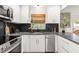 Bright kitchen with modern appliances, sleek cabinets, and a cozy window view at 204 Mindy Dr, Largo, FL 33771